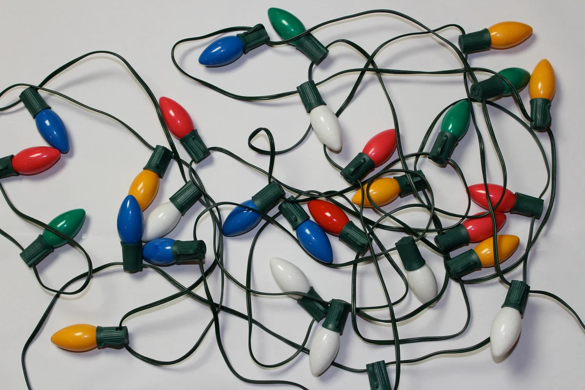 String of unlit vintage christmas lights on white background