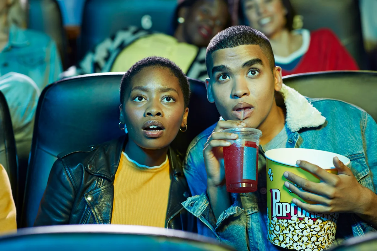 Couple watching a movie at the cinema