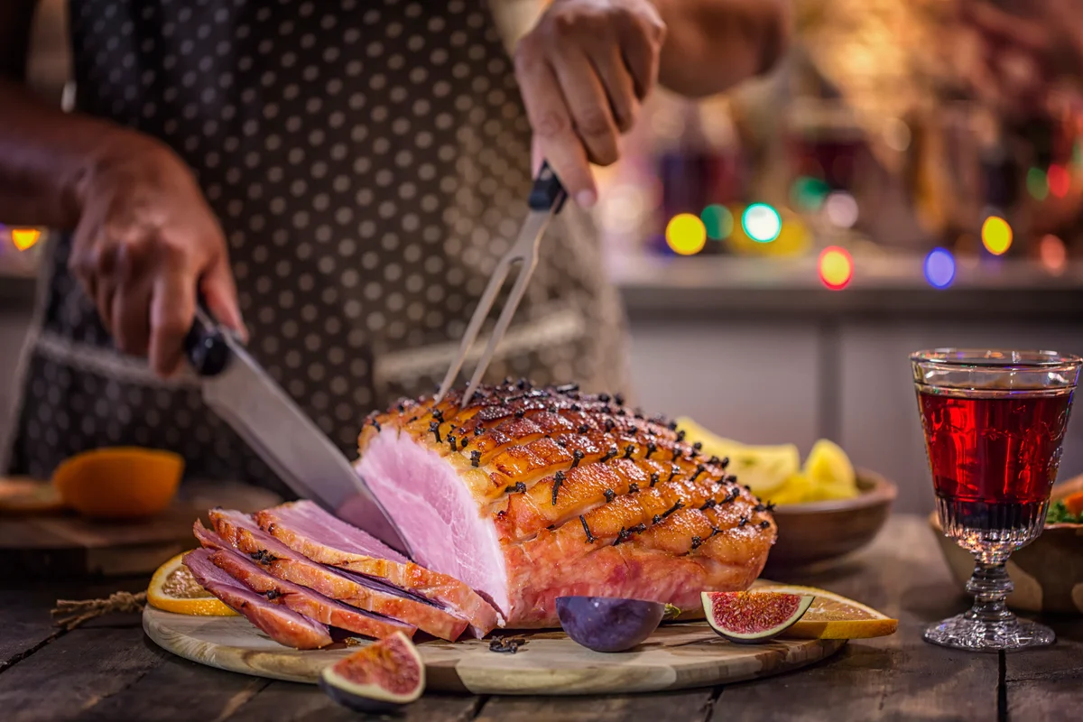 carving a clove ham
