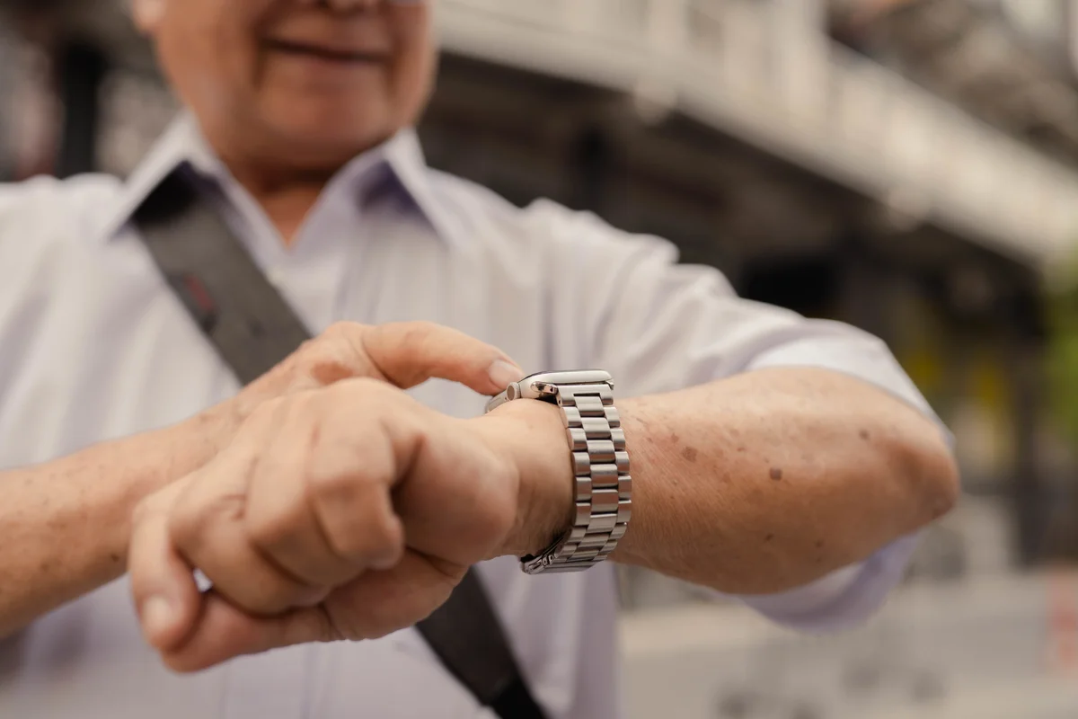 man using a calculator watch