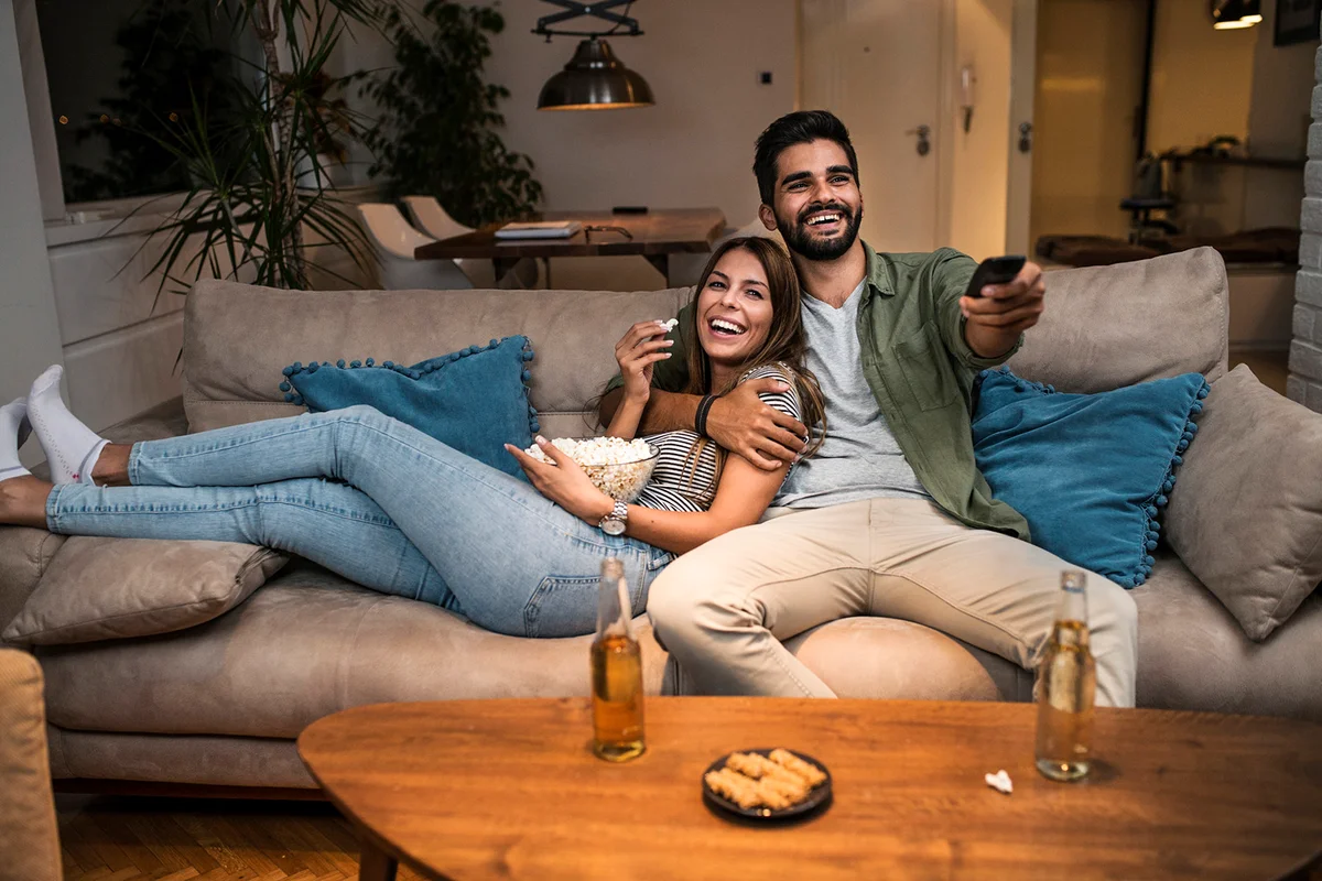 Couple on Sofa Watching TV
