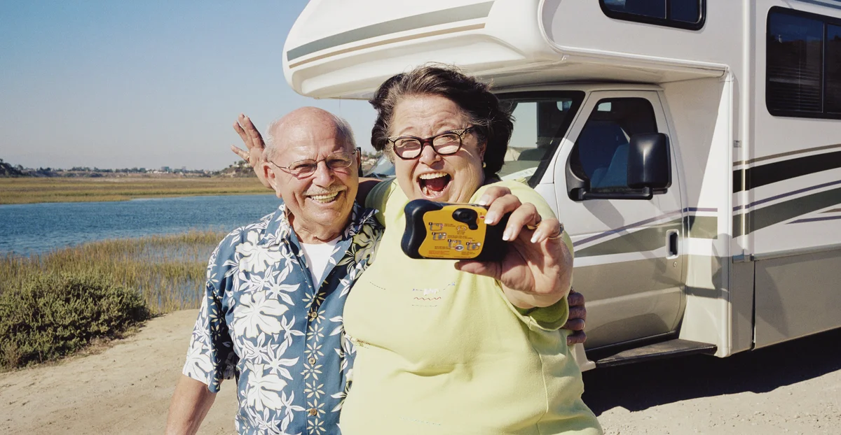 couple taking photo with disposable camera