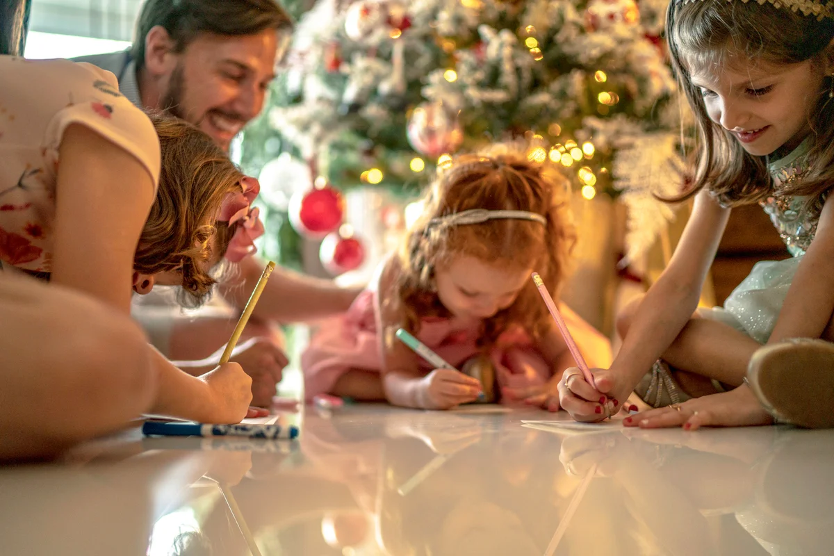 Small girls writing New Year's resolution