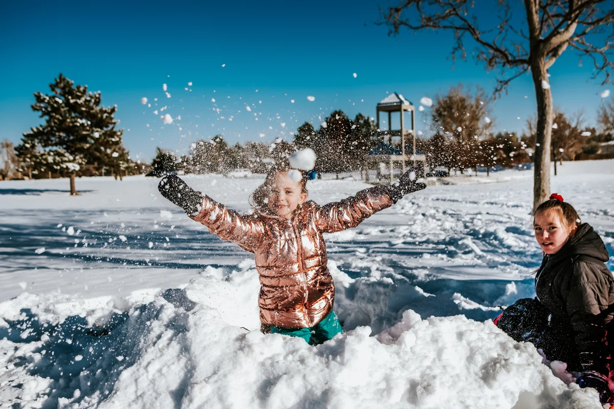 Girl outside playing in the snow
