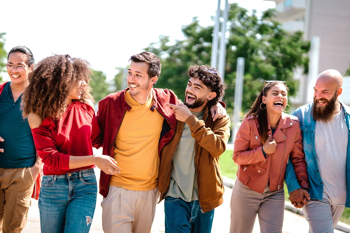 Group of friends walking together wearing colorful colors
