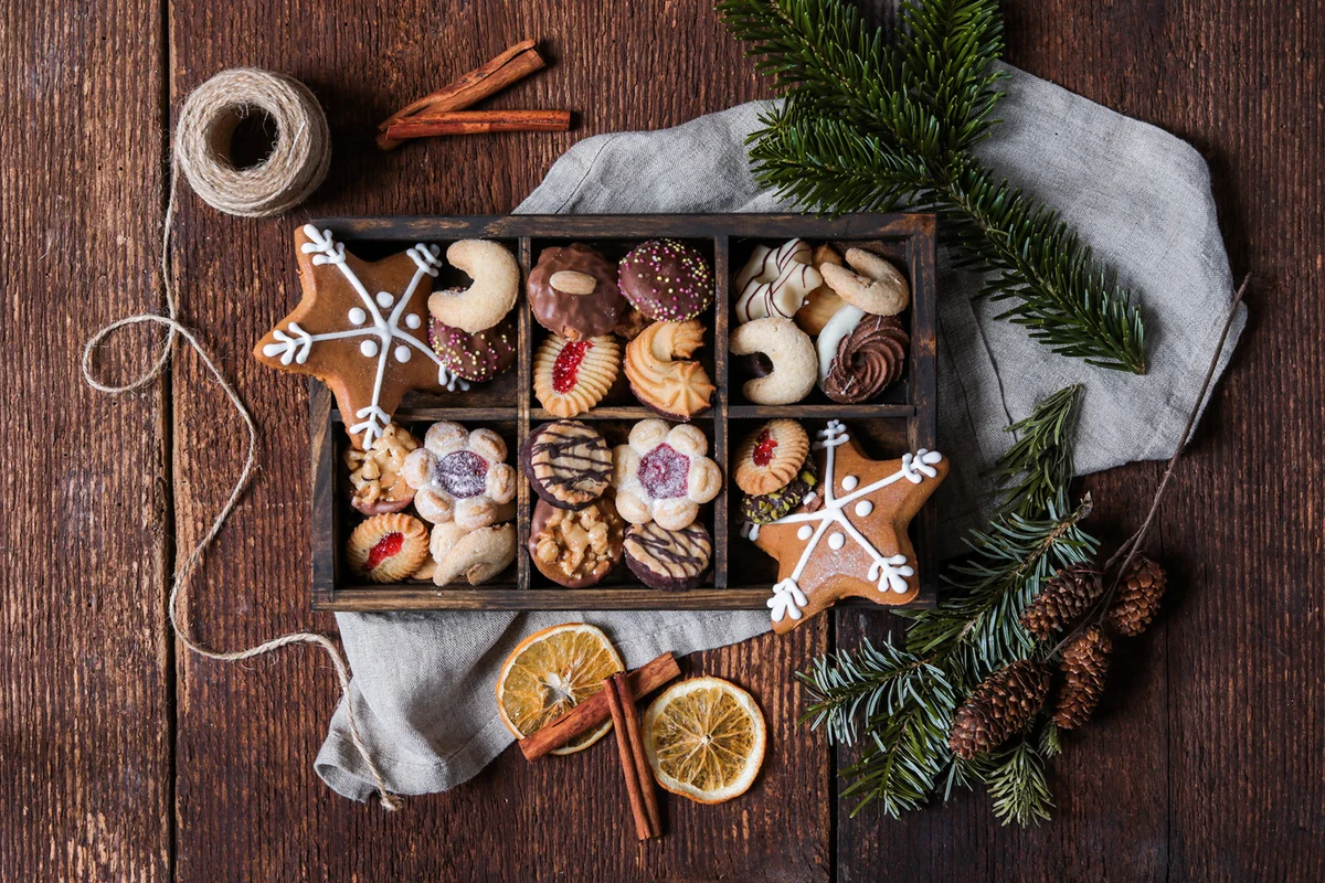 Christmas cookie box with gingerbread in rustic wood kitchen