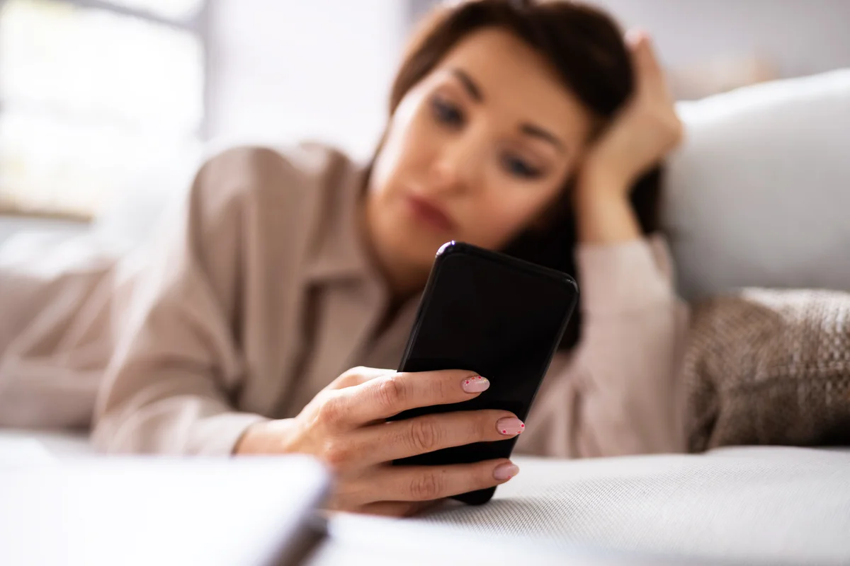 Woman waiting for text message
