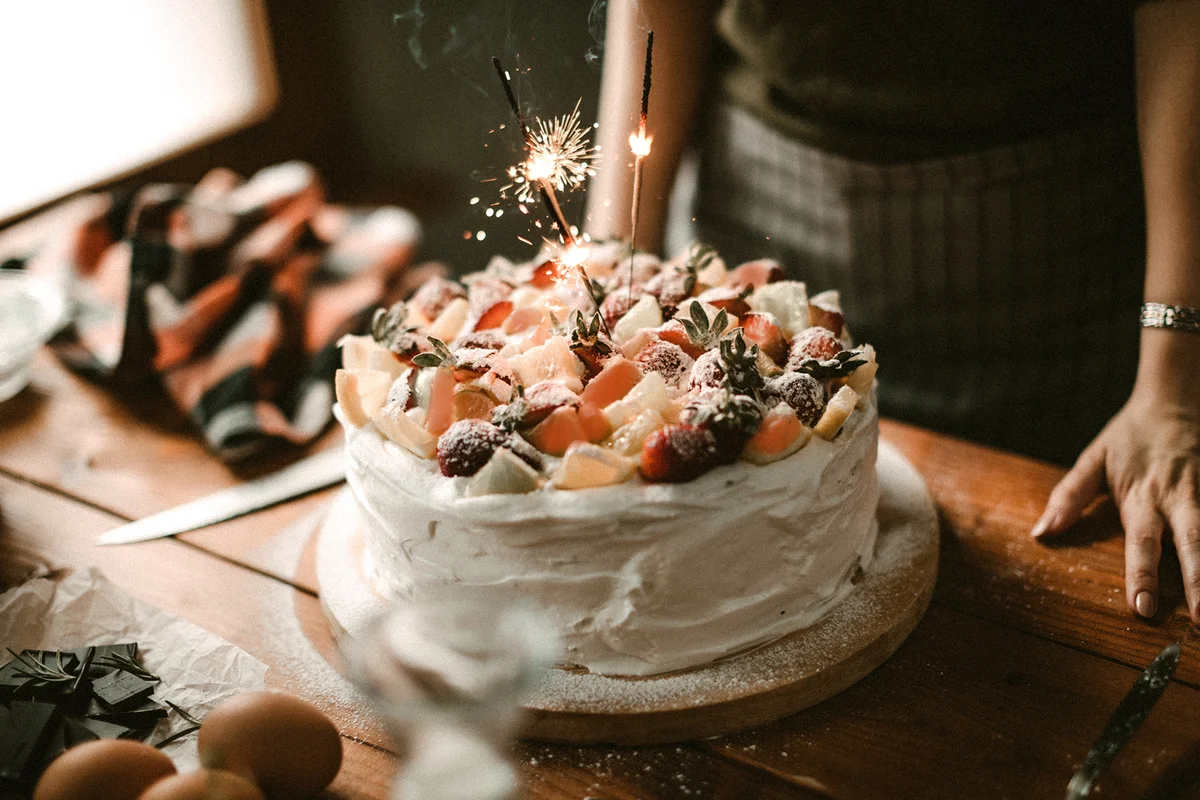 Woman making cake for celebration