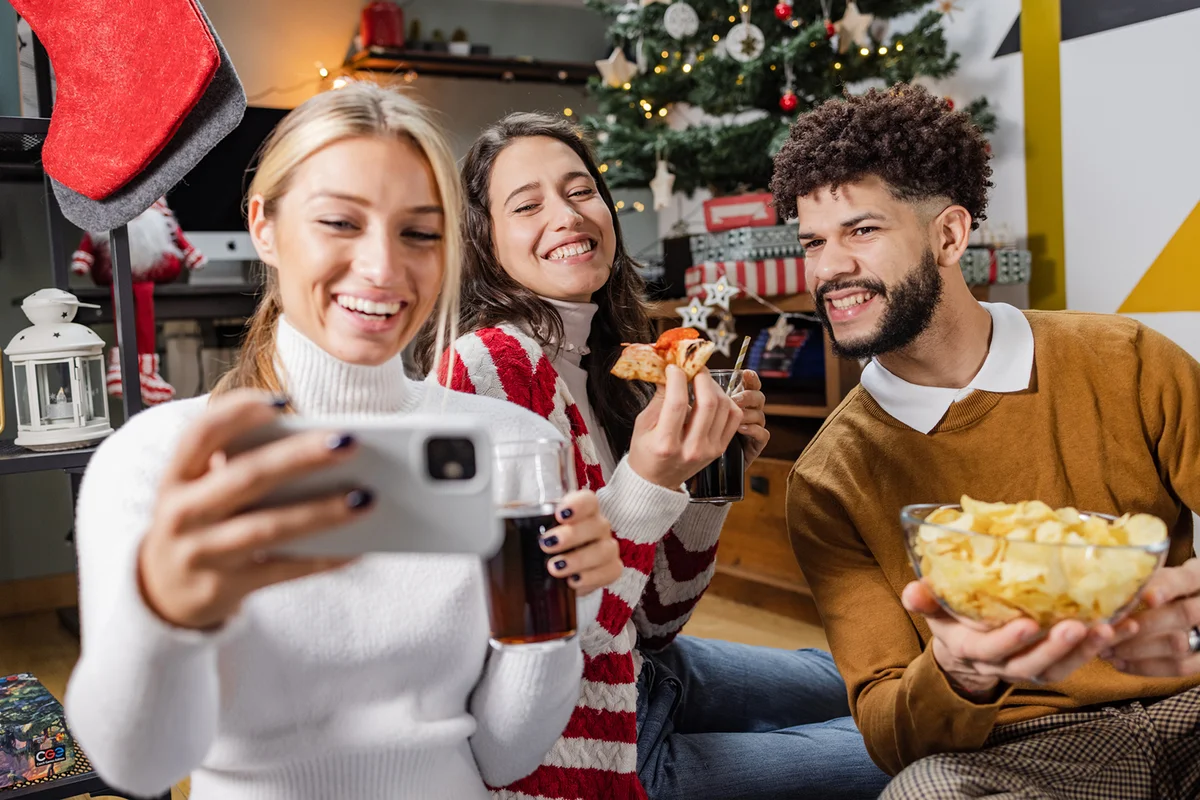 group of friends celebrating Christmas Eve at home