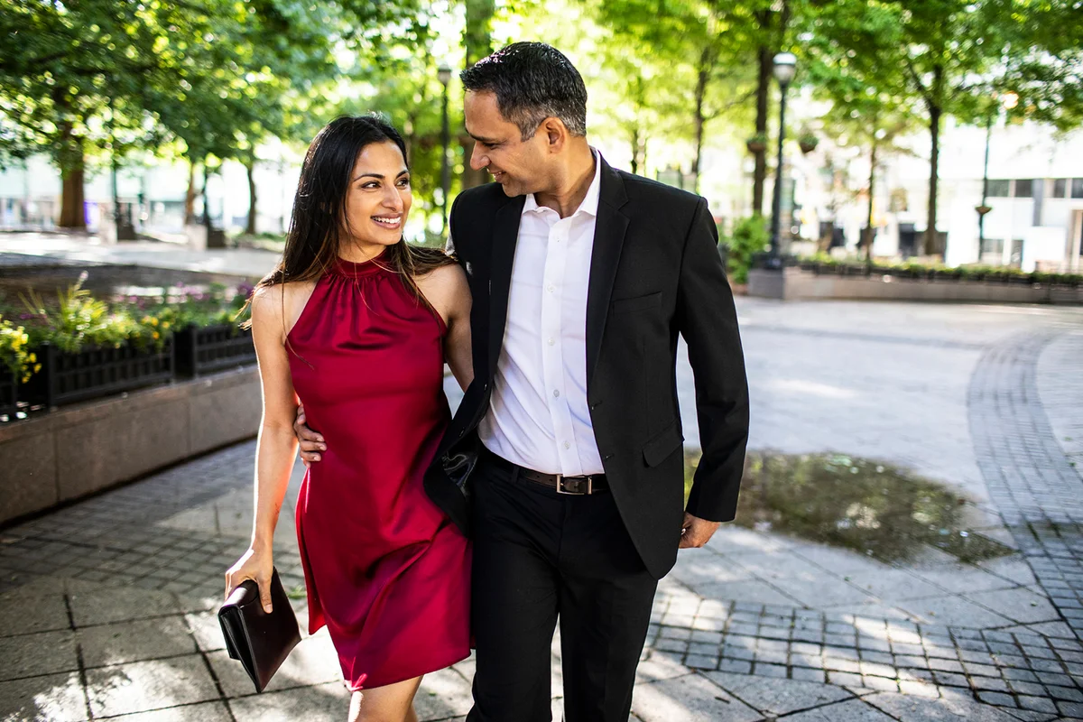 Married couple strolling through downtown park