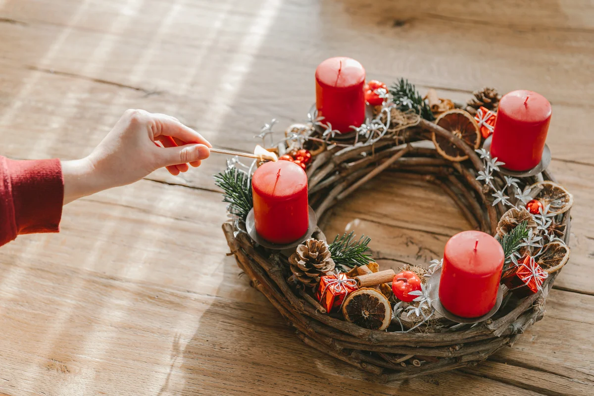 Advent wreath made with branches with four candles