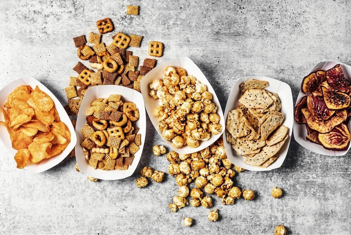 assorted snacks in paper trays