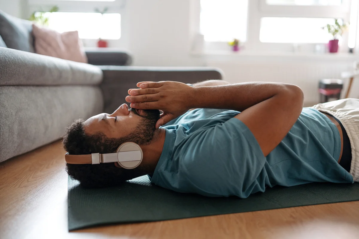 man meditating alone at home