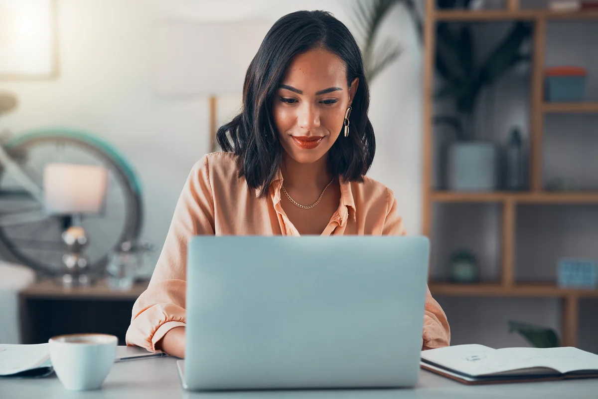 Woman working on laptop online