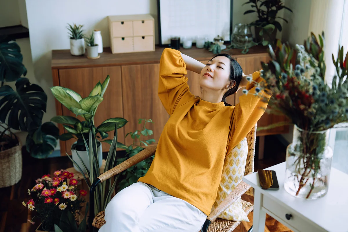 woman with hands behind her head
