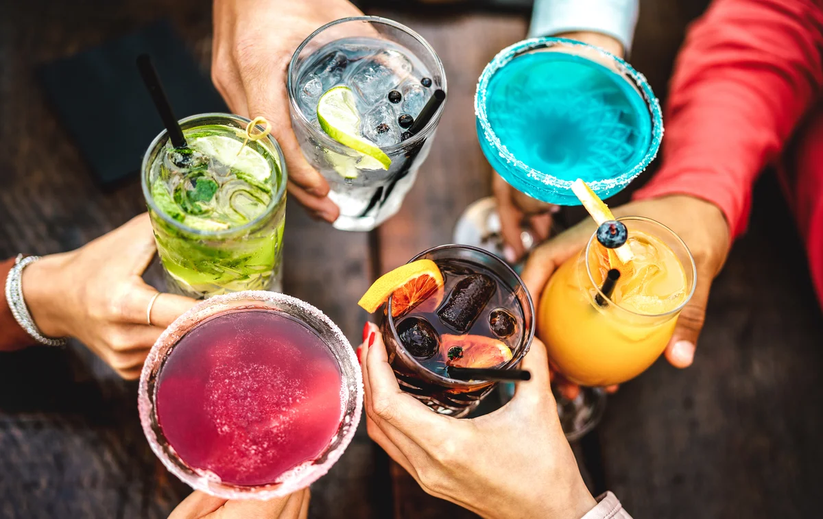 toasting with colorful cocktails