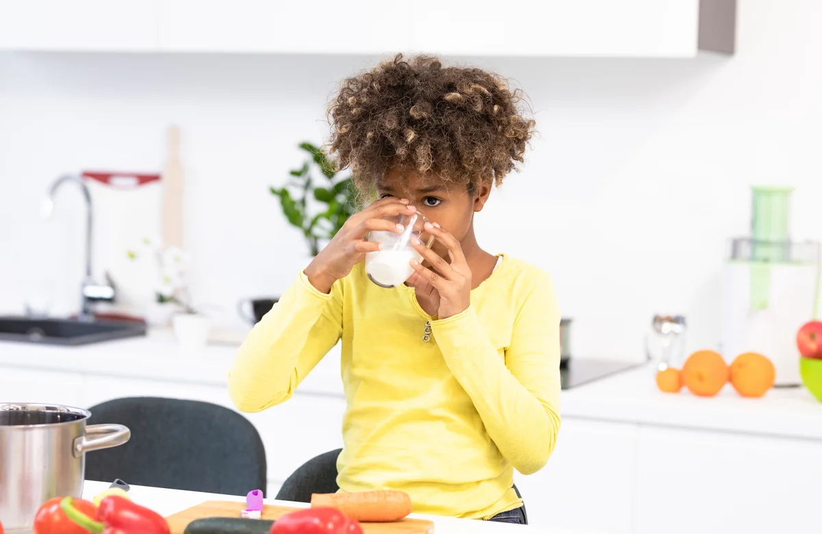 child drinking milk