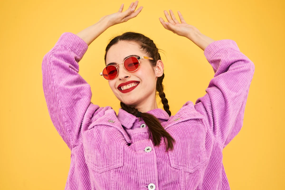 Colourful studio portrait of a young woman