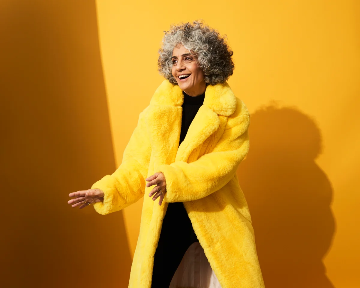 Portrait of a mature woman dancing and laughing