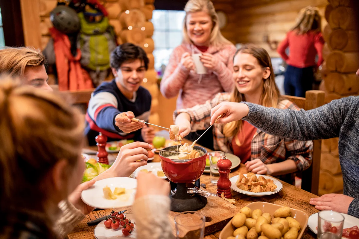 Friends Eating Fondue at Dinner