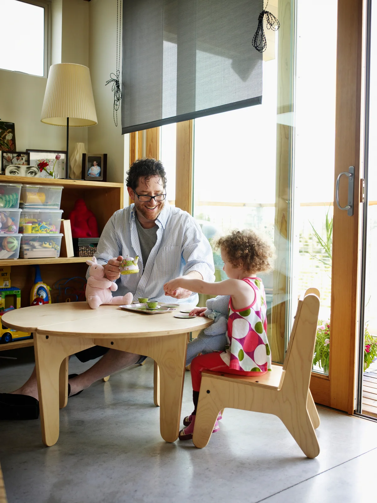 Father and young daughter having tea party