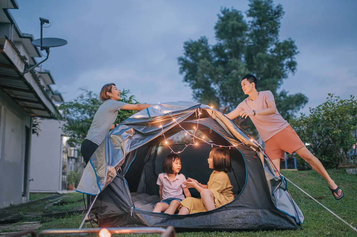 family camping in the backyard
