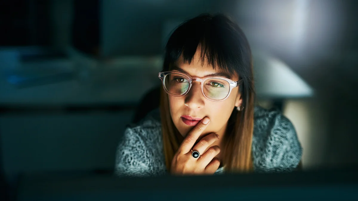 woman working on her computer late at night