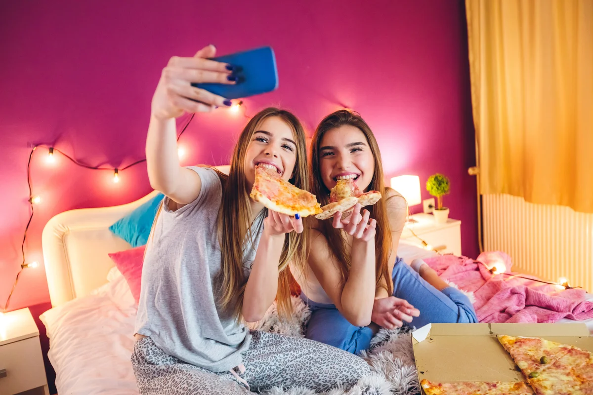Eating pizza at slumber party