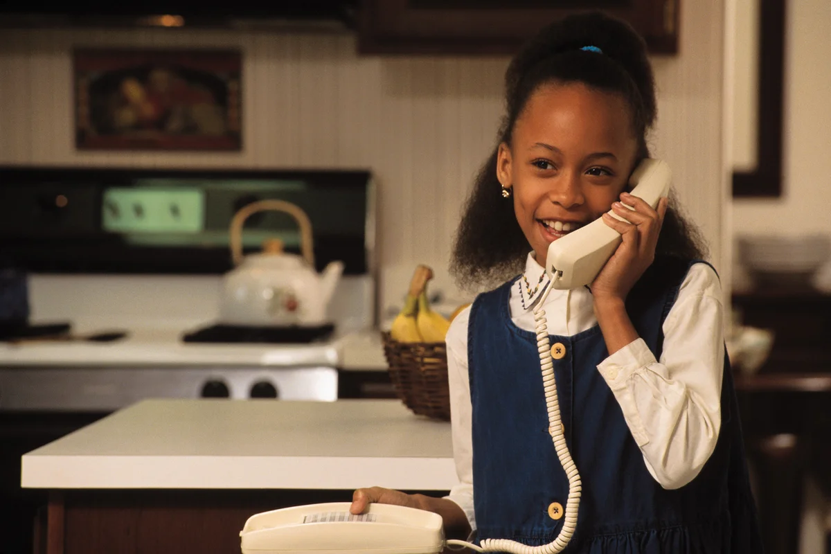 Young girl on telephone at home