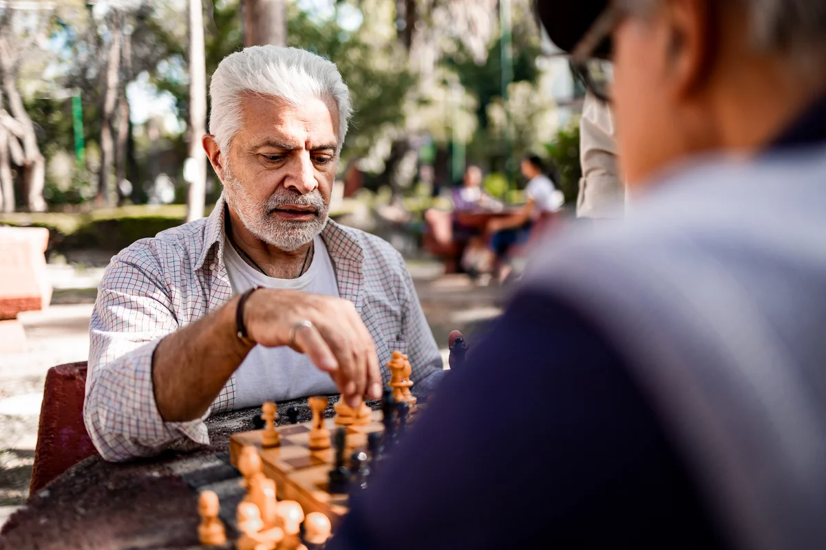 Senior friends playing chess