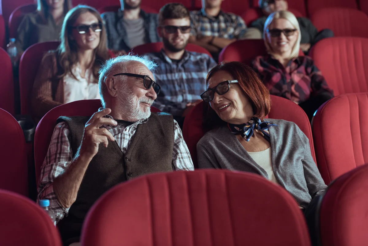 Senior couple watching 3D movie