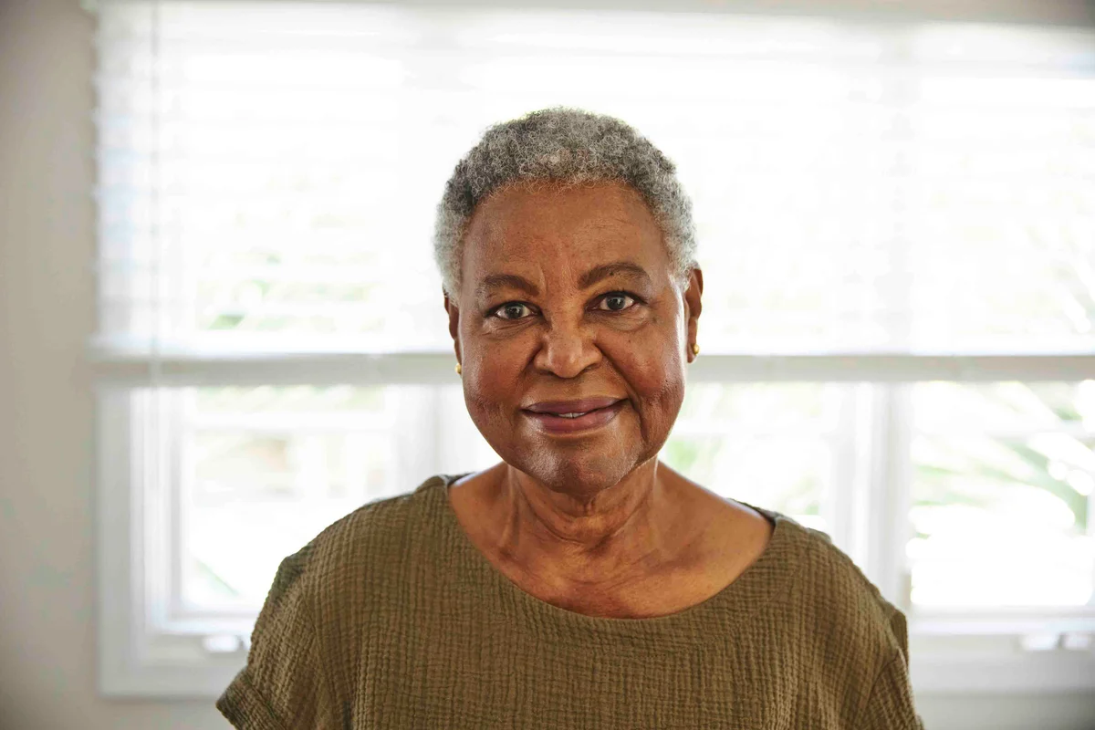 Portrait of cheerful senior woman with short gray hair