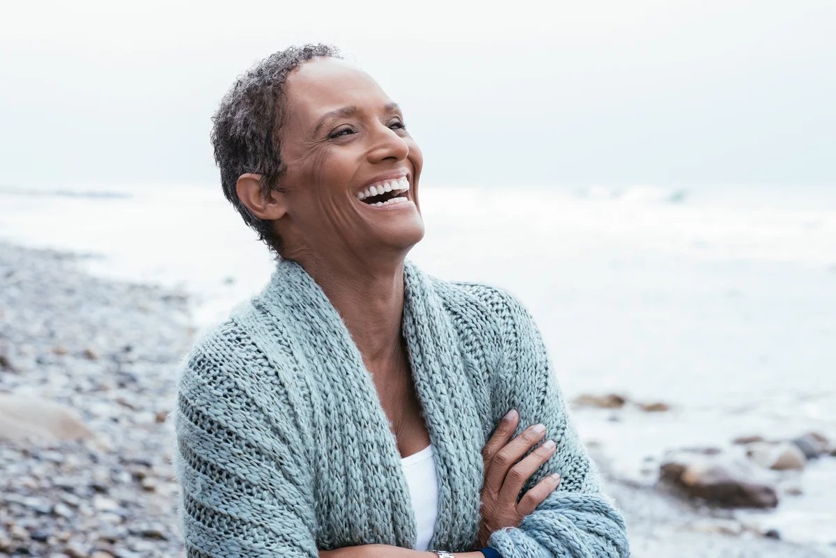 Woman with short grey hair smiling