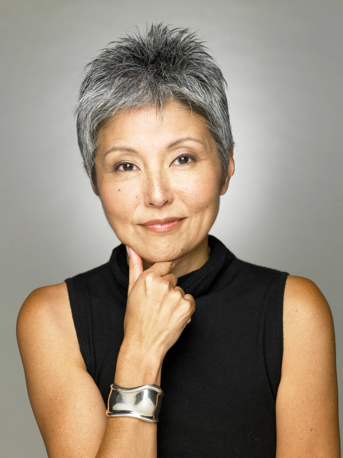 Mature woman wearing black top, portrait
