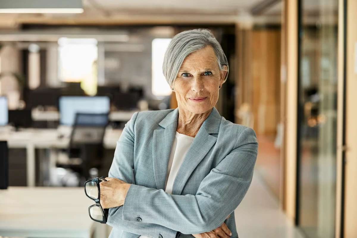 Senior Businesswoman With Arms Crossed In Office