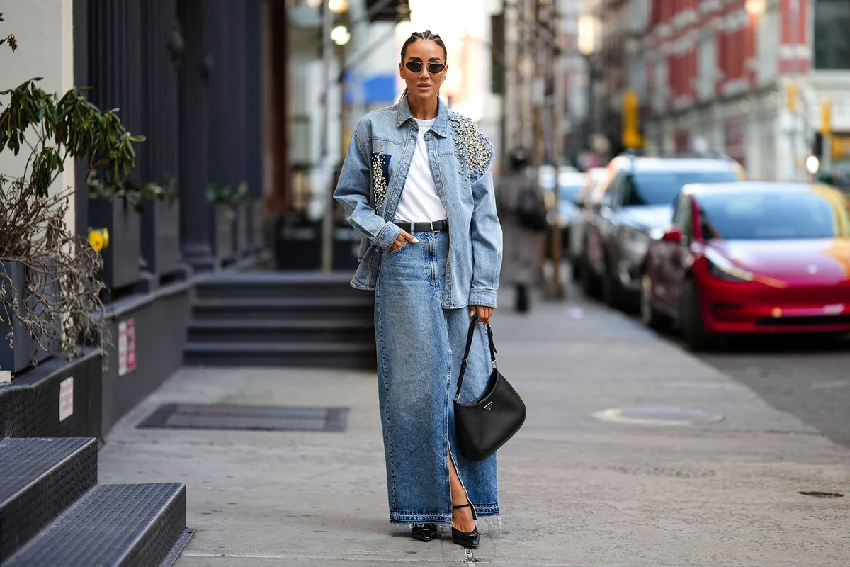 Woman with blue faded denim with embroidered large crystals details shirt jacket