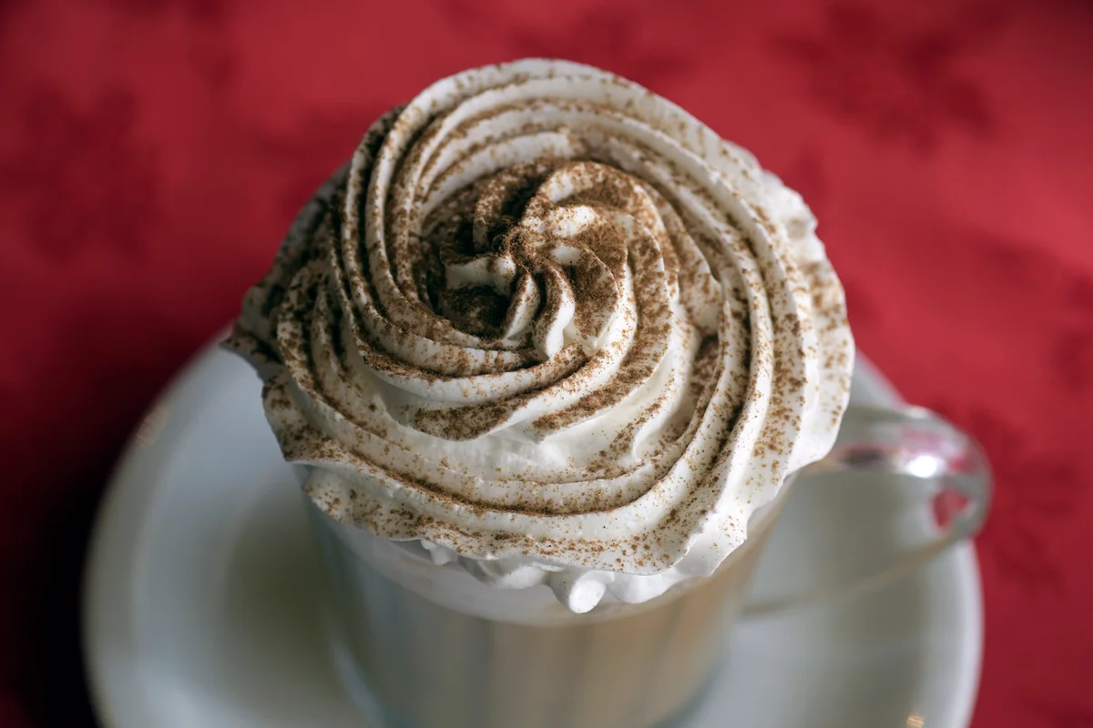 whipped cream on cappuccino