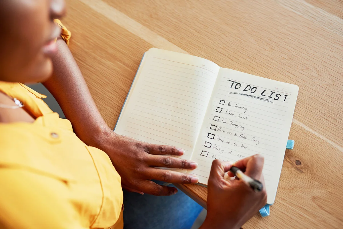 woman checking off boxes on her to-do list