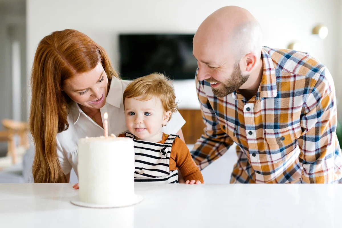 Parents and son with birthday cake