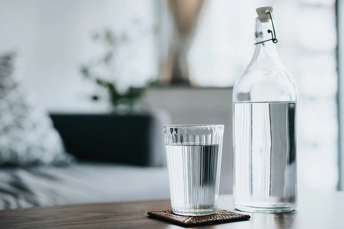A glass of water served on the coffee table