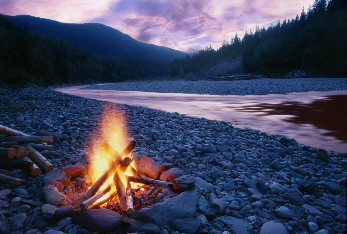 campfire by a river