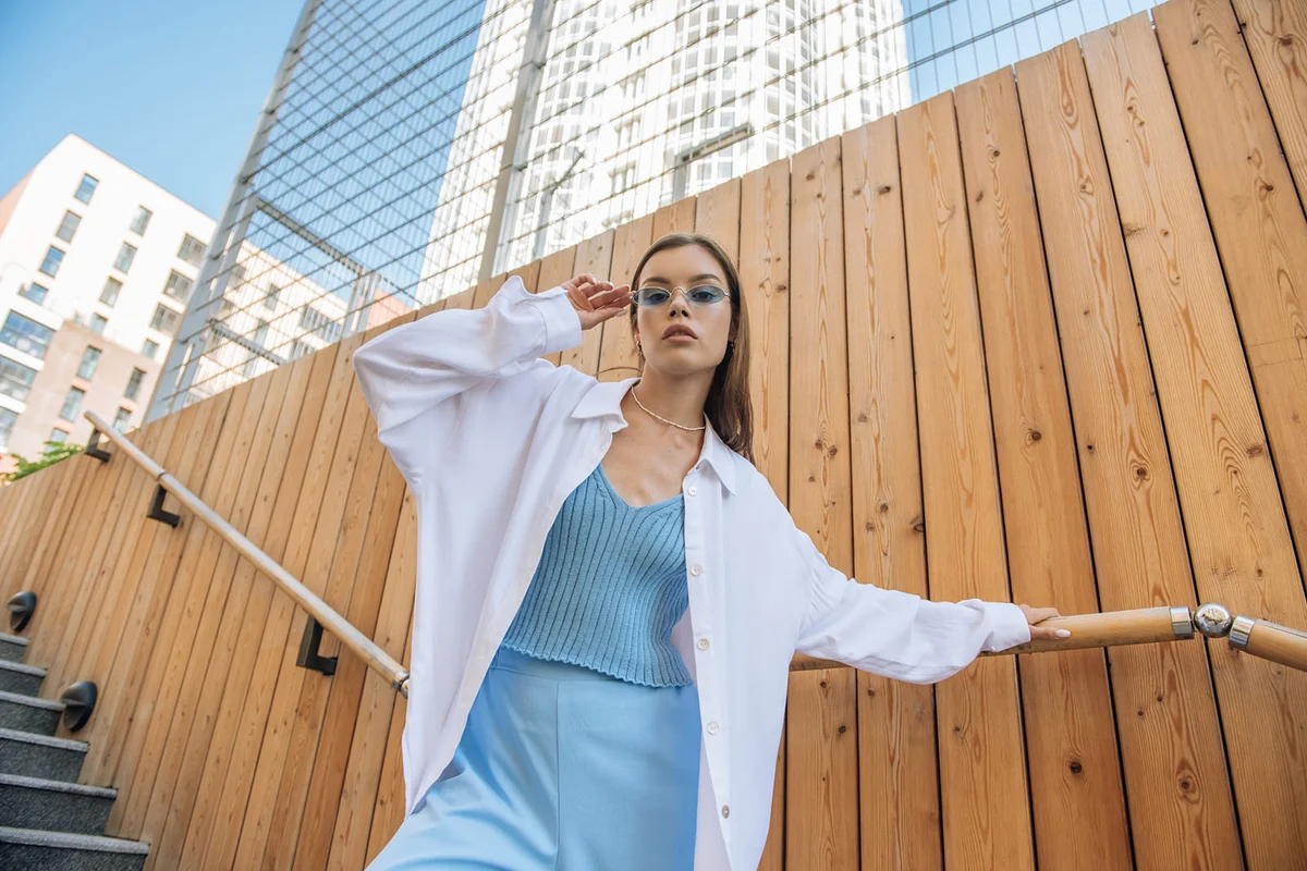 Fashionable woman in glasses looking at the camera