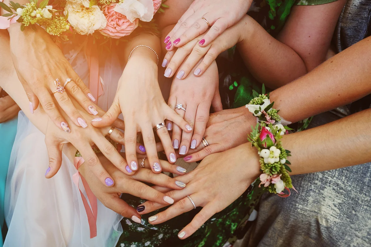 Hands of girls with rings at the wedding. Bridesmaid
