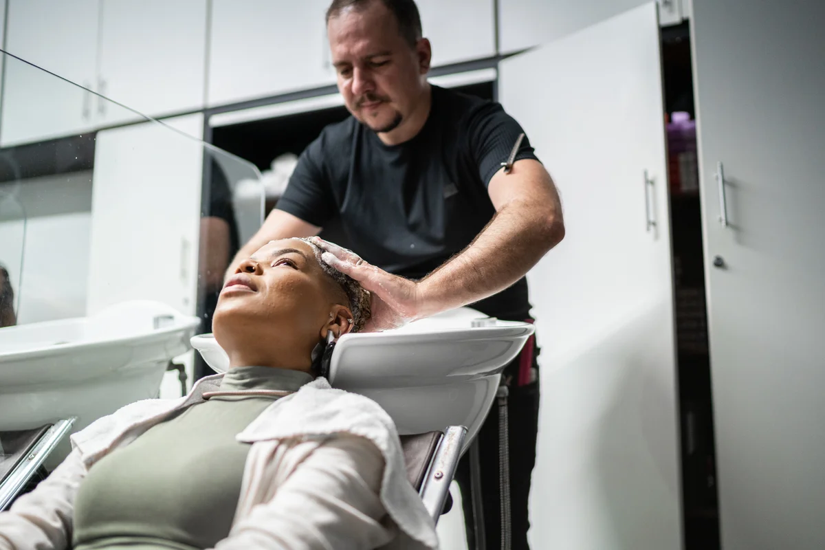 getting hair washed in a salon