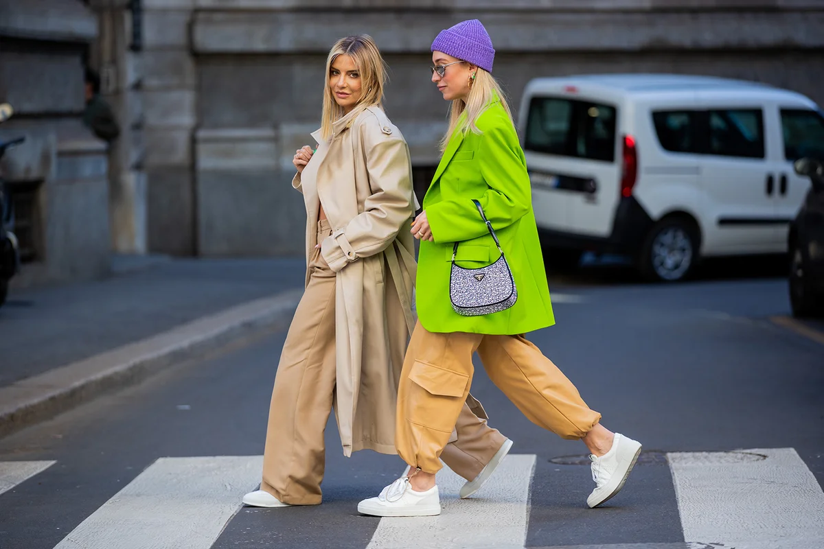 stylish friends crossing street