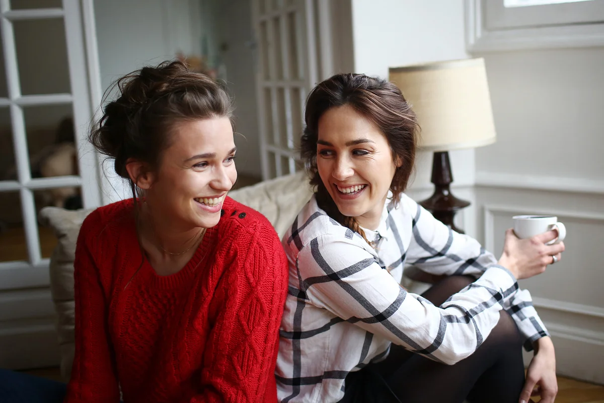 Two friends laughing together