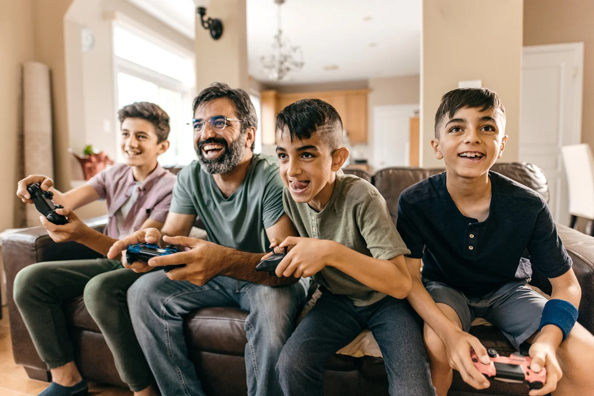 Family playing videogame