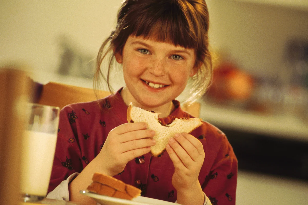 girl eating a PB&J