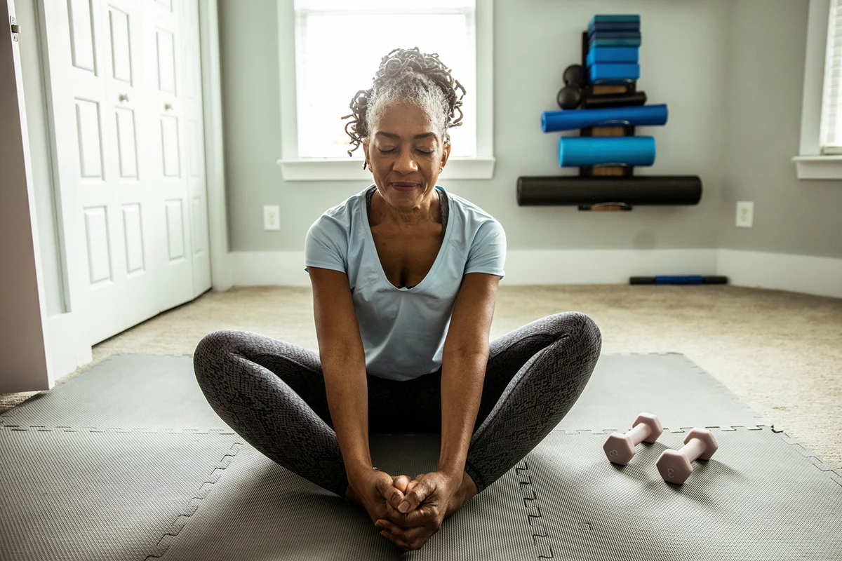 Senior woman exercising in home gym