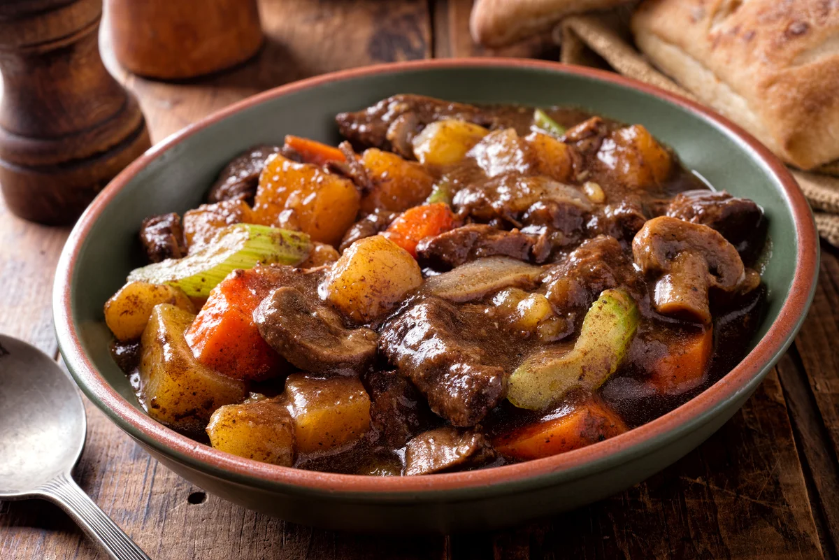 Slow cooker beef stew served in a dish.